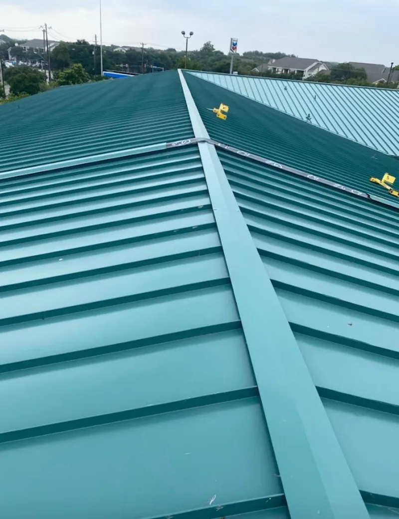 Green commercial metal roof ridge and valley for Metal Roof Repair in Whitewater